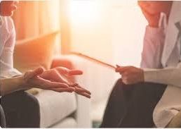 Phiona Hutton Counsellor and Integrative therapist, in person Havant, Hampshire or online nationwide. Two people engaged in a conversation, one gesturing with hands and the other listening.